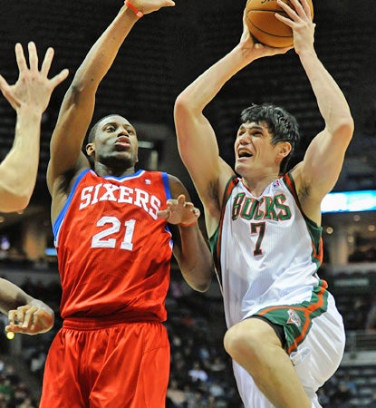 Ersan Ilyasova (right) scores 27 points and grabs 16 rebounds to lead the Bucks over the reeling 76ers. (US Presswire)