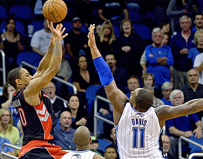 DeMar DeRozan leads Toronto with 22 points, including this game-winner over the Magic's Glen Davis. (AP)