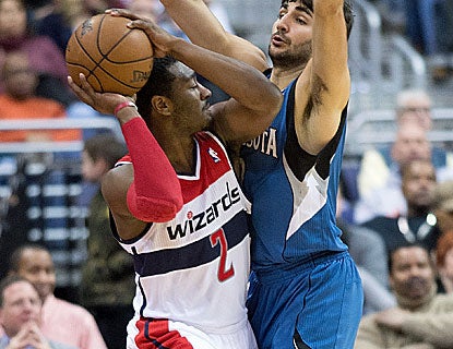 Washington's John Wall scores 14 points to go with  five assists in his first start of the season. (Getty Images)