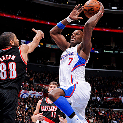 Lamar Odom grabs a game-high 13 rebounds in a reserve role to help the Clippers get past the Trail Blazers. (Getty Images)