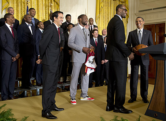 Obama tells LeBron, 'It's your world' when King James asks to say a few words Monday. (AP)