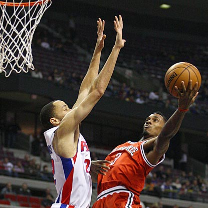 Brandon Jennings gets warmed up by driving to the basket against Detroit's Tayshaun Prince during the first quarter.  (US Presswire)
