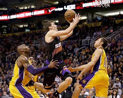 Kobe Bryant and Steve Nash (right) watch Suns guard Goran Dragic drive to the basket during the second half.  (US Presswire)