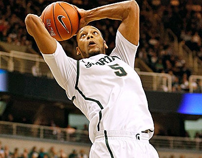 Michigan State center Adreian Payne dunks home 2 of his 8 points. He also grabs 6 rebounds against Illinois. (Getty Images)