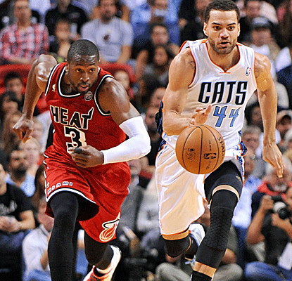 Dwyane Wade gives his normal defensive effort while chipping in with 20 points and 12 boards in a Heat win.  (US Presswire)