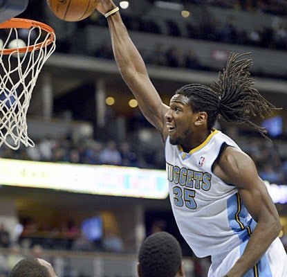 Kenneth Faried, who finishes with 13 points and 10 rebounds, throws down a dunk against the Bucks. (Getty Images)
