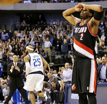 Much to the delight of Rick Carlisle (left), Vince Carter nails a crucial jumper late against Wesley Matthews and the Blazers. (AP)