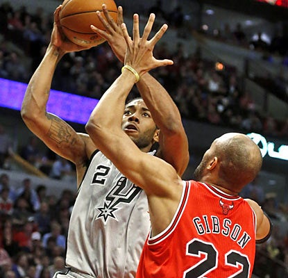 Kawhi Leonard steps up for the hobbled Spurs with a career-high 26 points and plays a game-high 44 minutes. (AP)