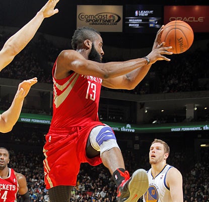 Despite a nagging left knee and twisting his right ankle, James Harden fights through the pain and finishes with 27 points. (Getty Images)