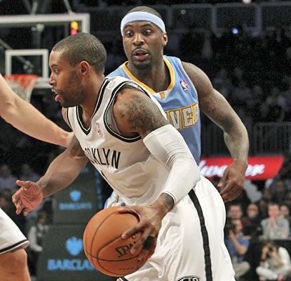 Point guard C.J. Watson scores 25 points, one of three Nets to finish with 20 or more points. (AP)