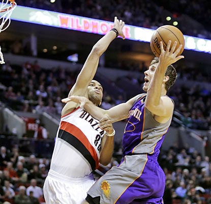 Will he shoot or will he pass? Goran Dragic provides a career-high 18 assists to go along with his 16 points. (AP)