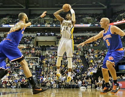 Tyson Chandler (left) and Jason Kidd (right) can only watch as Paul George scores two of his 27 points against the Knicks. (AP)