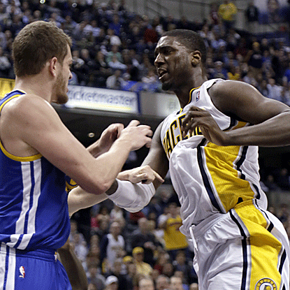 David Lee (left) and Roy Hibbert exchange shoves and ignite a brawl that causes the ejection of the Pacers' center. (AP)