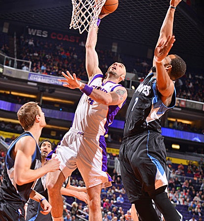Marcin Gortat hits big shots at the end of regulation and overtime to help the Suns pull out a win over the Wolves in OT. (Getty Images)