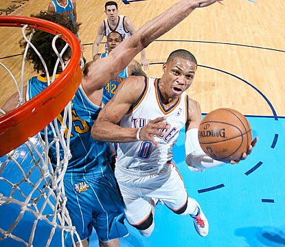 Oklahoma City's Russell Westbrook finds his way around New Orleans' Robin Lopez en route to a 29-point outing.  (Getty Images)