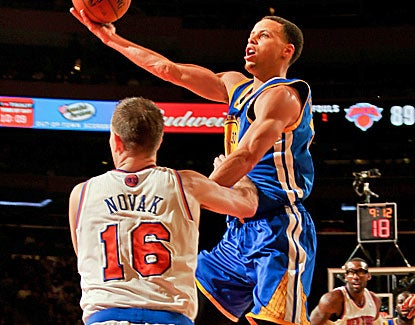 Golden State's Stephen Curry goes 18 of 28 from the field, finishing one shy of the NBA record with 11 3-pointers. (Getty Images)