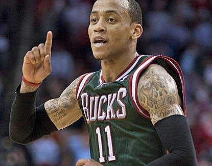 Milwaukee's Monta Ellis celebrates his game-winning shot against the Rockets. Ellis goes for 27 points and 13 assists. (Getty Images)