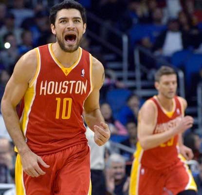 Carlos Delfino (10) and Chandler Parsons (background) score 21 points each to end a five-game losing streak against the Magic.  (AP)