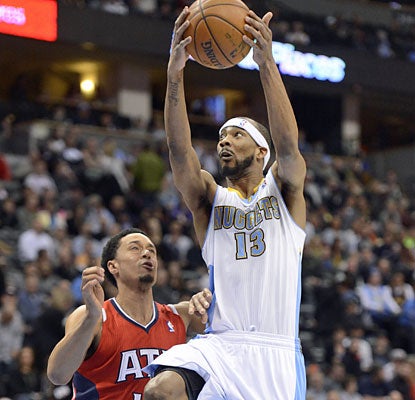 Corey Brewer (22 points) and the Nuggets match Miami for the best home record in the NBA at 26-3. (Getty Images)