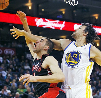 The Warriors' Andrew Bogut makes his presence felt as he logs 30 minutes in his first action since February 20. (AP)