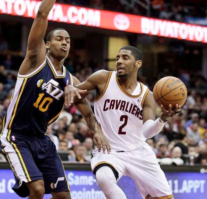 Kyrie Irving scores eight of his 20 points down the stretch to spark Cleveland's rally over the Jazz.  (AP)