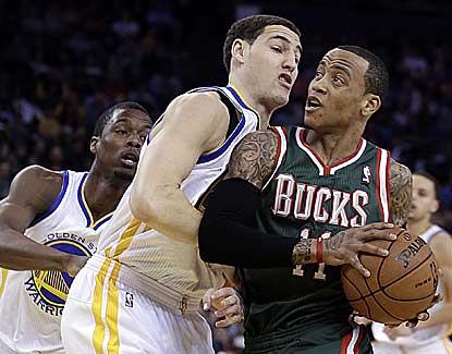 Monta Ellis scores 26 points with five assists to lead Milwaukee past Golden State, his former team. (AP)