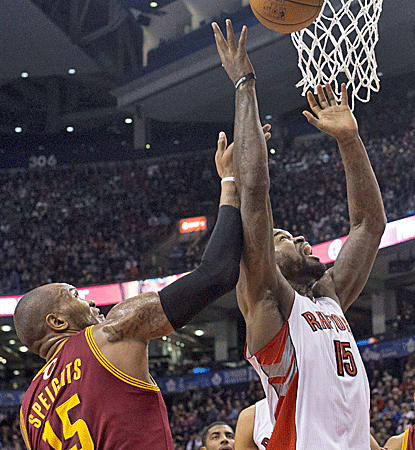 Amir Johnson posts a double-double with 17 points and a career-high 16 rebounds in Toronto's win.  (AP)