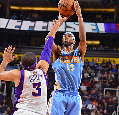 Corey Brewer scores 20 points to help the Nuggets win their ninth straight and approach 30 victories at home.  (Getty Images)