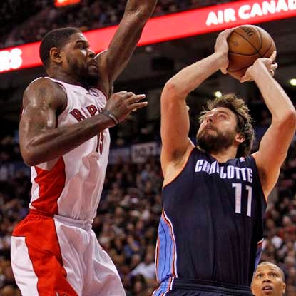Amir Johnson mixes it up in the paint, nabbing a career-high 21 rebounds to go with 12 points for the Raptors.  (USATSI)