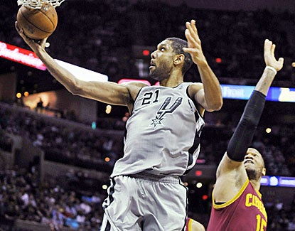 Tim Duncan shows up in fine form, scoring 30 points, grabbing 12 rebounds and blocking five shots. (AP)