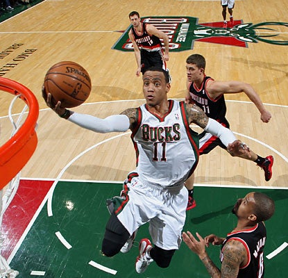 Monta Ellis fills the stat sheet as he puts up 21 points, nine boards, eight dimes, three steals and three blocks. (Getty Images)