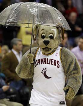 Moondog, the Cavs mascot, gets some protection from the scoreboard spill. (AP)