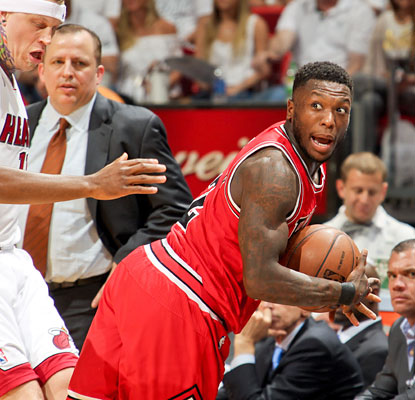 Nate Robinson overcomes a busted lip to score 27 points for the Bulls, who score the final 10 points to steal Game 1 in Miami. (Getty Images)