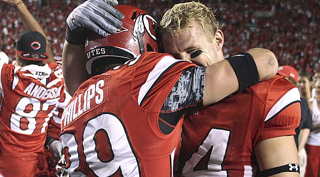 Kicker Joe Phillips gets a hug from teammate Christian Cox after Phillips' winning kick. &nbsp;(AP)