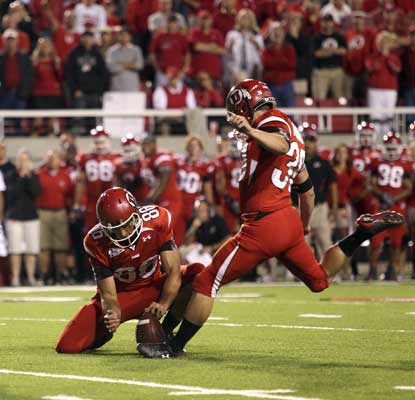 Utah kicker Joe Phillips knocks in the winning field goal during overtime to upset No. 15 Pittsburgh. (AP)