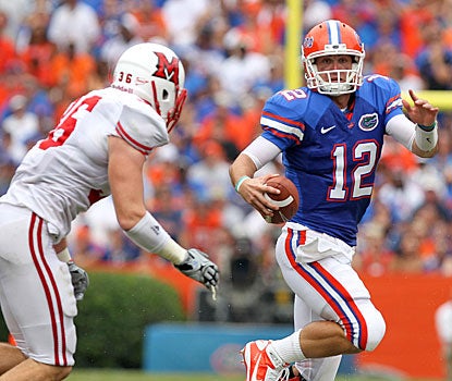 John Brantley feels heat from the Miami defense and his own fans in a less-than-stellar debut as Florida's starting QB.  (US Presswire)