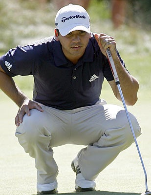 Jason Day goes on a run late in the day and gets himself a share of the lead. (AP)