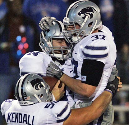 The Wildcats seem appreciative of Carson Coffman (center), who scores five total touchdowns.  (AP)