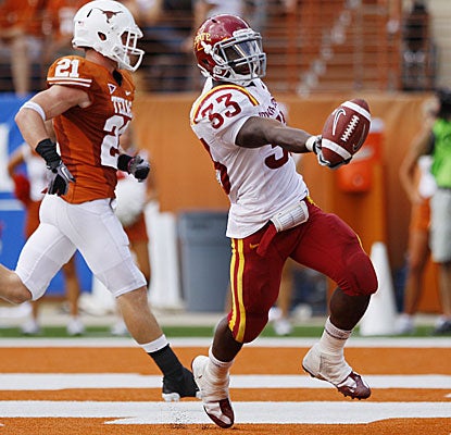 Iowa State's Alexander Robinson scores a touchdown as Texas' Blake Gideon trails the play.  (AP)