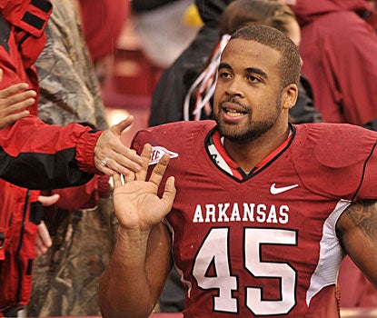 Arkansas tight end D.J. Williams greets fans after Saturday's win at Fayetteville.  (AP)