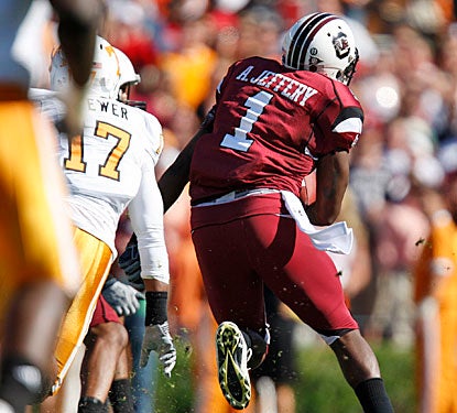 Tennessee defenders get a good look at Alshon Jeffery's back as he breaks free for the decisive 70-yard touchdown.  (AP)