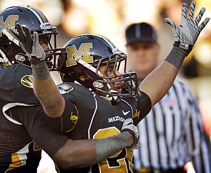 De'Vion Moore scores on Missouri's first drive, then caps the Tigers' output with a fourth-quarter touchdown.  (AP)