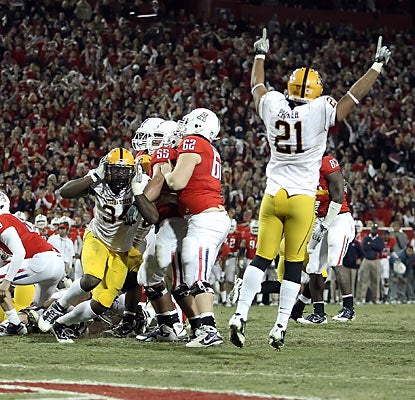 DE James Brooks (34) blocks an Arizona extra point twice -- including in 2OT -- to help ASU pull out the improbable victory.  (Getty Images)