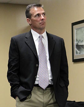 Urban Meyer, can you please gently slide out the back door so Will Muschamp has room to breathe? (AP)
