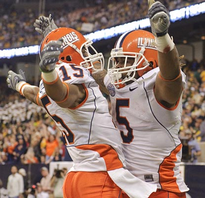 Mikel LeShoure (right) has a huge game, earning him MVP honors for his three TDs.  (US Presswire)