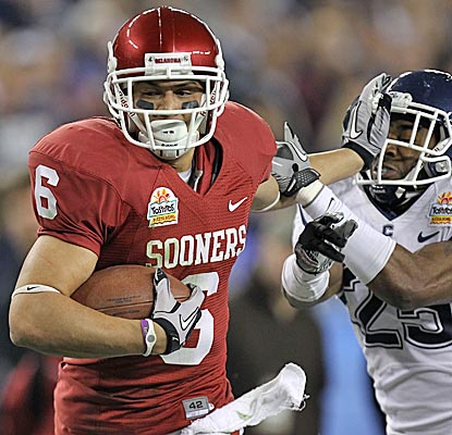 Cameron Kenney and the No. 9 Sooners keep the Big East champion Huskies at arm's length. (Getty Images)