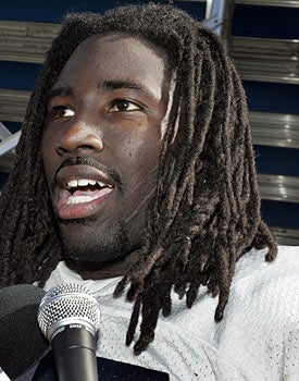 Stanley McClover, a former Auburn player, says he was given money during college. (AP)