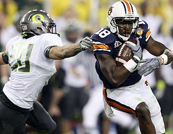 Both participants in the last BCS title game, Oregon and Auburn, are being investigated by the NCAA. (Getty Images)