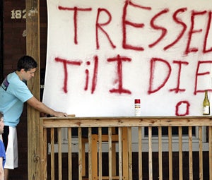 Ohio State students show which side of the argument they're on Monday with a quickly constructed banner. (AP)