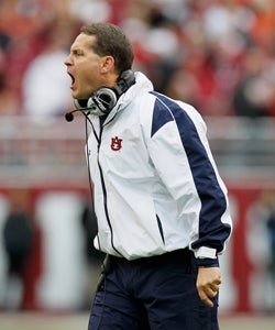 Auburn coach Gene Chizik feels strongly that league policy should remain at signing 28 players. (Getty Images)